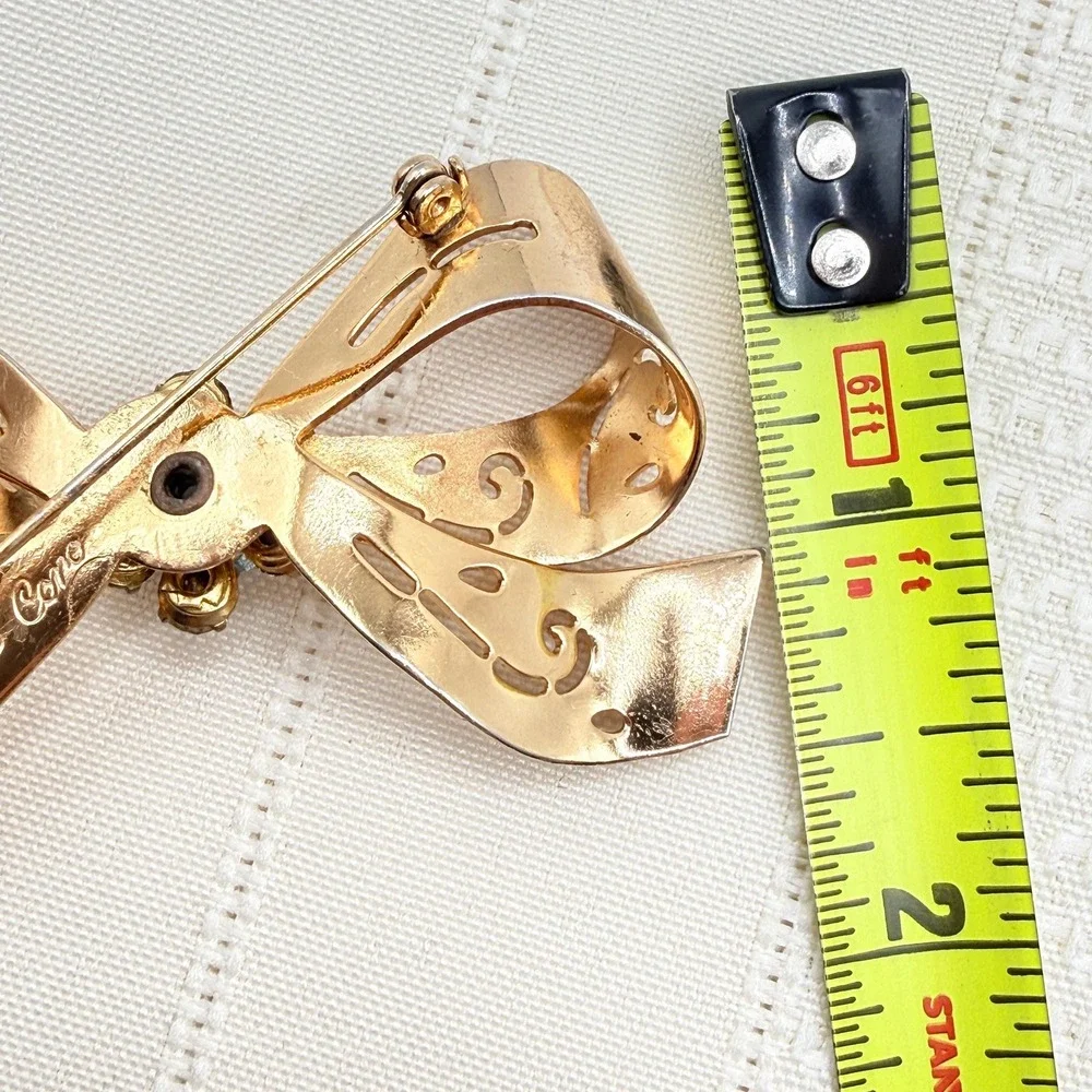 Vintage CORO Gray and Blue Rhinestones Gold Tone Cutout Bow Pin Brooch